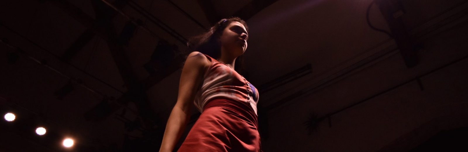 Theatre at UWC Atlantic Artist on stage in Tythe Barn Theatre entertaining the audience