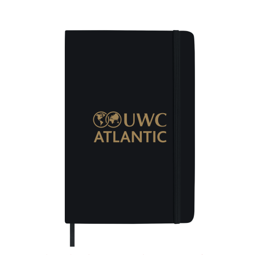 black notebook with gold foil UWC Atlantic logo
