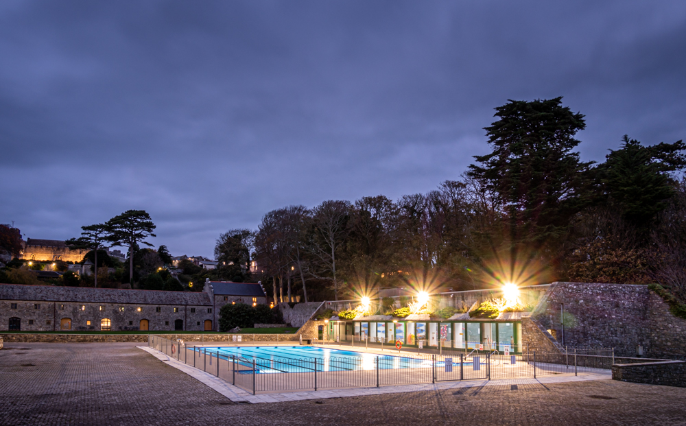 Outdoor pool at St Donat's Castle at night