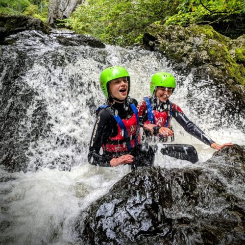 AAE participants at the bottom of a waterfall