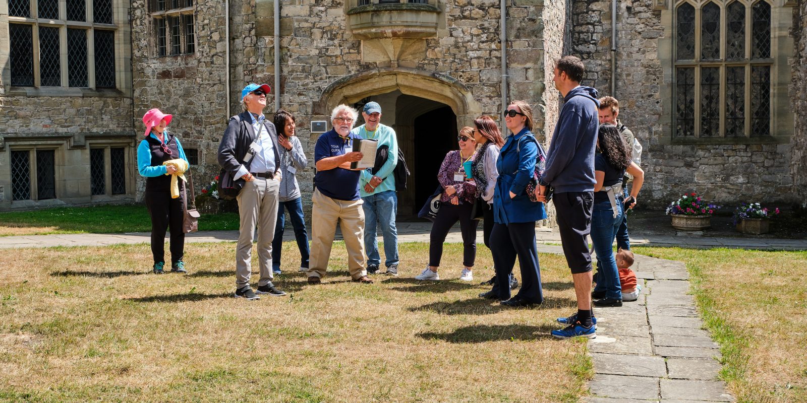 group of people having a tour of St Donat's Castle
