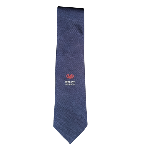 Blue UWC Atlantic silk tie with white UWC Atlantic logo and red Welsh dragon