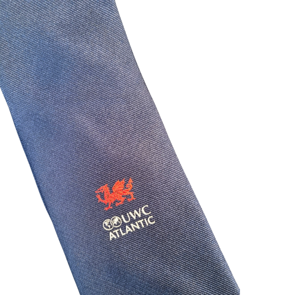 Blue silk tie with UWC Atlantic logo in white and red dragon