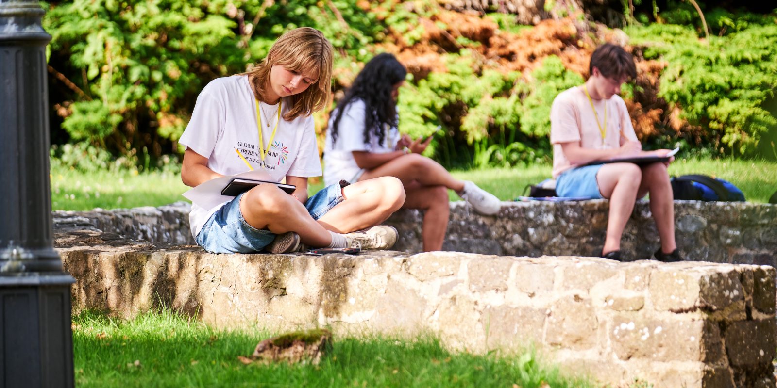 Girl studying for GLE sat outdoors