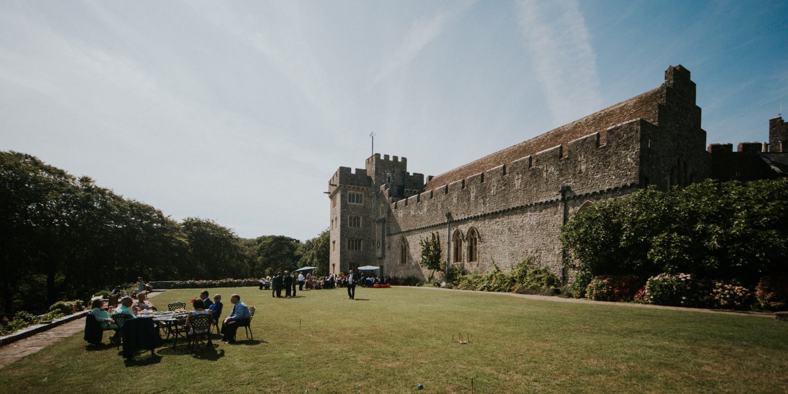 Image of St Donat's Castle setup for a wedding on a sunny blue sky day.