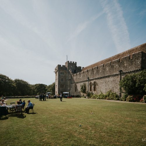 Image of St Donat's Castle setup for a wedding on a sunny blue sky day.