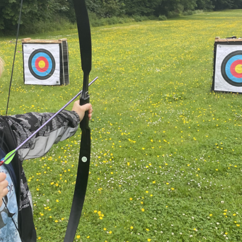 Young boy playing archery